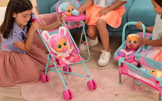 Girls Playing with Cry Babies Baby Doll Stroller in Pink