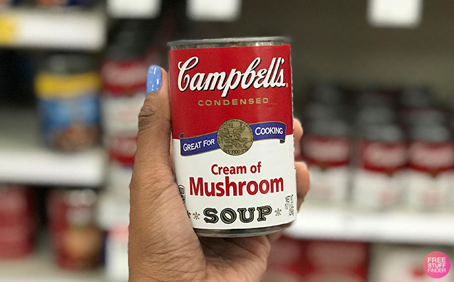 Hand Holding Campbells Condensed Cream of Mushroom Soup