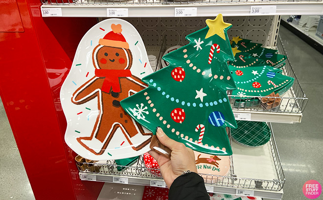 Hand Holding Christmas Melamine Gingerbread Man Snack Bowl and Christmas Melamine Tree Appetizer Plate in Target