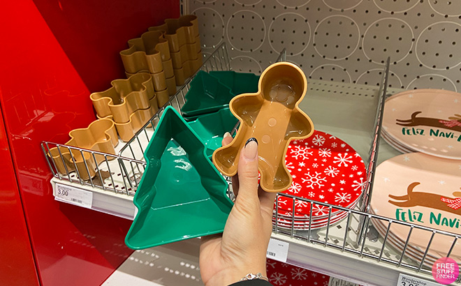 Hand Holding Christmas Plastic Figural Tree Dip Bowl and Christmas Plastic Figural Gingerbread Dip Bowl