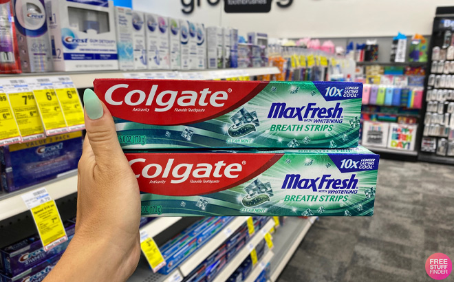 Hand Holding Colgate Max Fresh Toothpaste6 oz at CVS