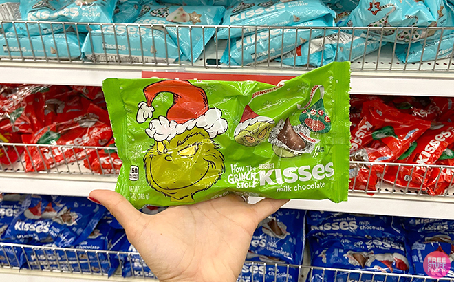 Hand Holding How the Grinch Stole Milk Chocolate Hersheys Kisses