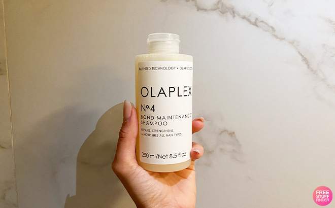 Hand Holding Olaplex Bond Maintenance Shampoo