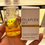Hand Holding Olaplex Bonding Oil