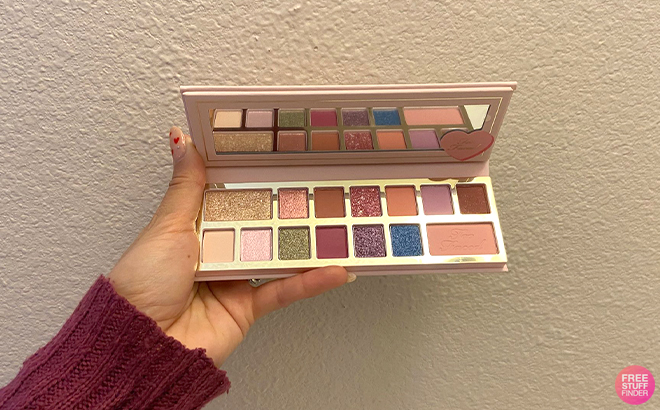 Hand Holding Open Too Faced Pinker Times Ahead Eyeshadow Palette