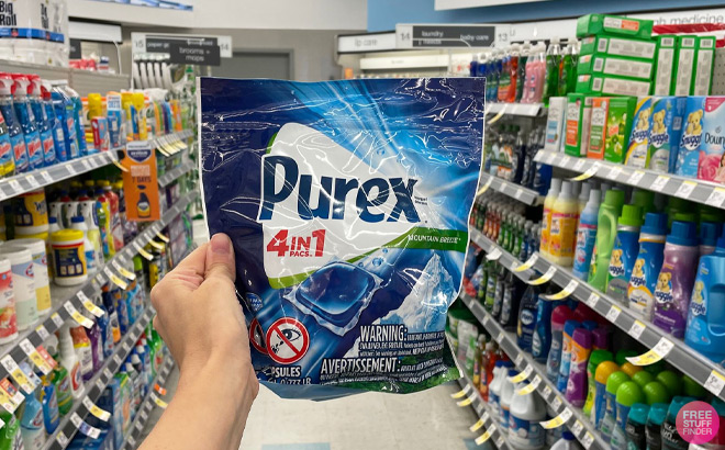 Hand Holding Purex Laundry Detergent Pacs at Walgreens
