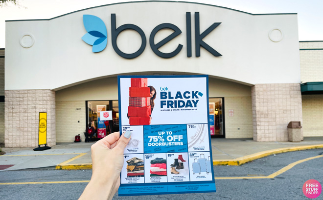 Hand Holding a Belk Black Friday Deals Print in Front of Belk Store