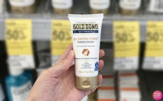Hand Holding a Gold Bond Eczema Relief Hand Cream