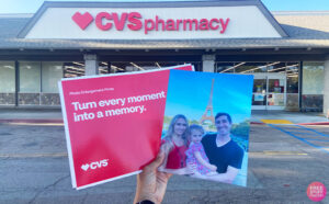 Hand Holding a Photo in front of a CVS Store