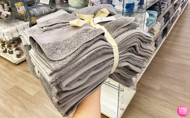 Hand Holding a The Big One 12 piece Bath Towel Set in Gray