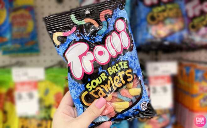 Hand Holding a Trolli Sour Brite Crawlers Candy Bag