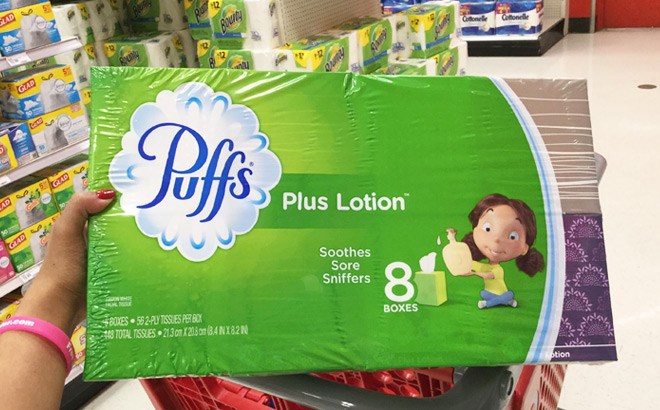 Hand Holidng a Box of Puffs Facial Tissue