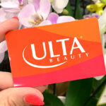 Hand holding Ulta Beauty Gift Card