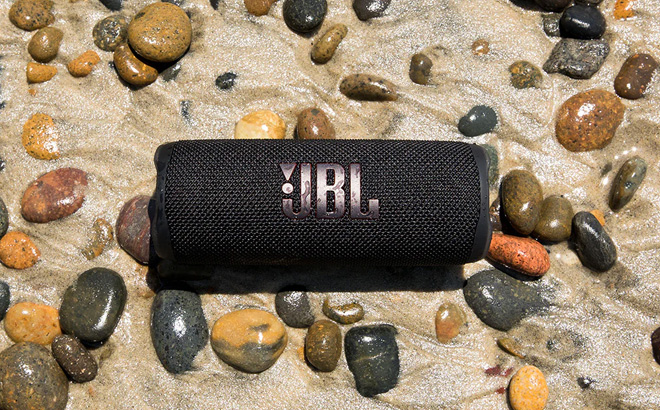 JBL Flip 6 Portable Waterproof Speaker on the Beach