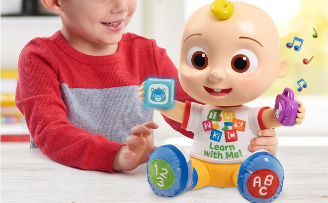 Kid Playing with CoComelon Interactive Learning JJ Doll