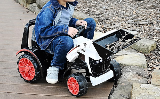 Kid Playing with Electric Kids Bobcat Tractor Ride On