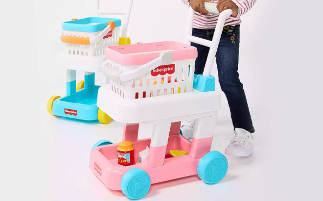 Kid Playing with Fisher Price Shopping Cart