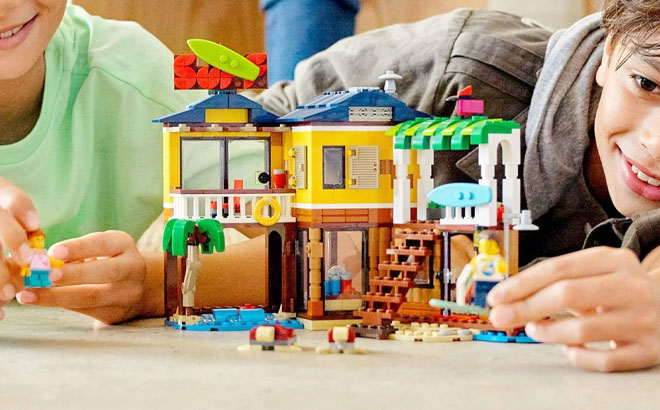 Kids Playing a LEGO Creator Beach House 564 Piece Building Set