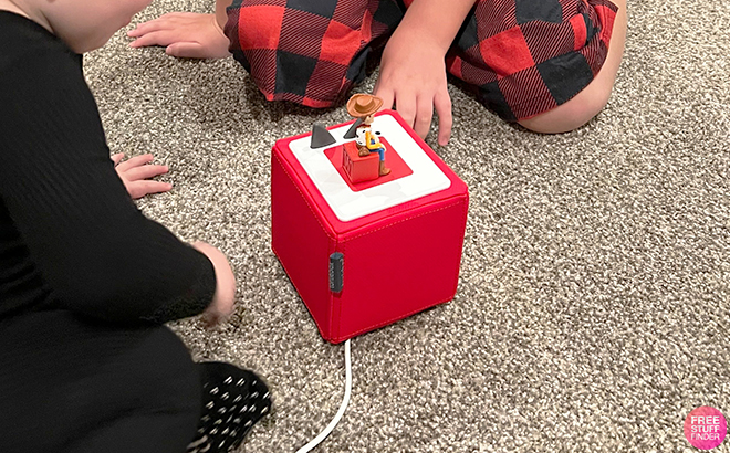 Kids Playing with Toniebox Audio Player Starter Set with Playtime Puppy in the Color Red