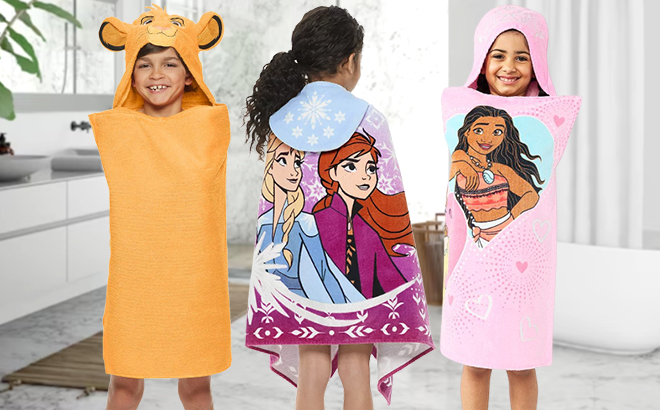 Kids Wearing The Big One Disney Hooded Towels in a Bathroom