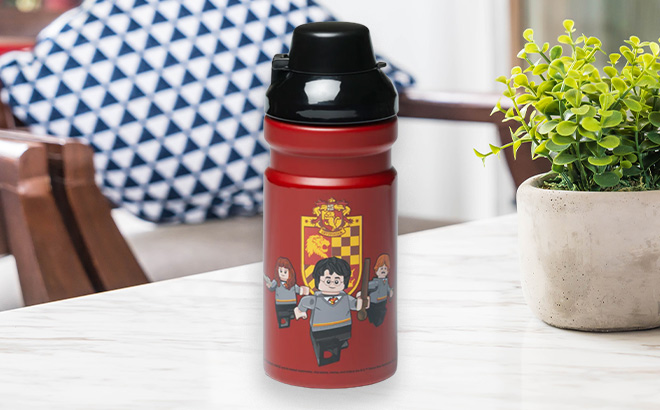 LEGO Harry Potter Red Gryffindor Water Bottle on the Table