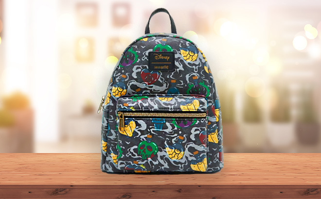 Loungefly Disney Villains Icons Mini Backpack on the Table