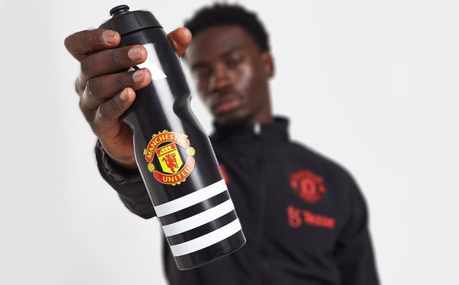 Man Holding Adidas Manchester United Bottle
