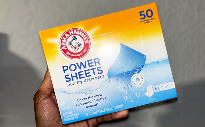 Person Holding Arm Hammer Power Sheets Laundry Detergent 50 Count Box