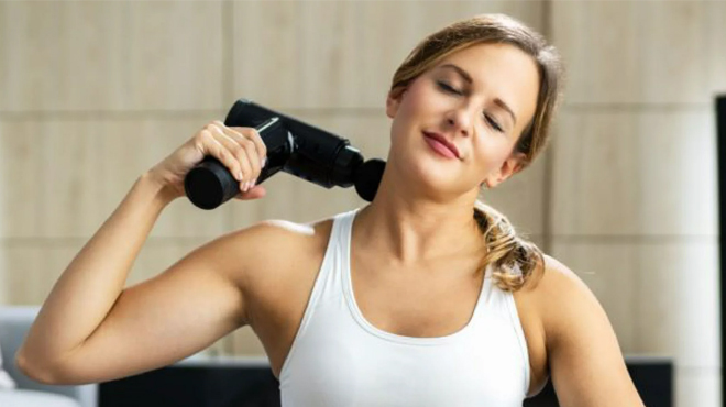 Person Using Life Authentics Wireless Massage Gun