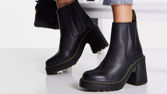 Person Wearing Dr Martens Chelsea Boots Person Wearing Dr Martens Chelsea Boots
