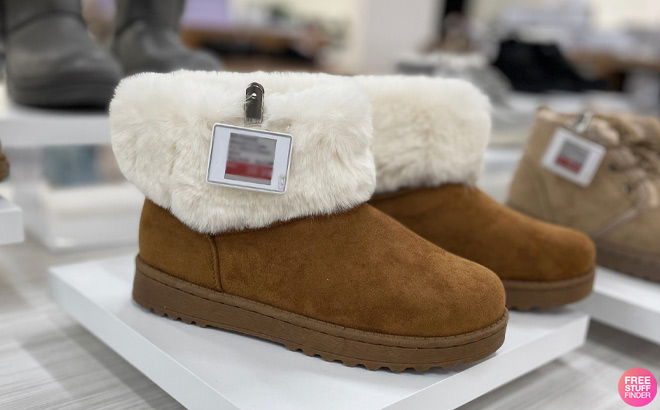 A Pair of SO Coatimundi Women’s Faux Fur Winter Boots on Display at Kohl's