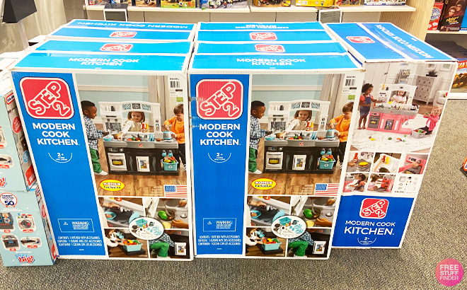 Several Step2 Modern Cook Kitchen Pretend Playsets in Boxes at a Kohl's Store