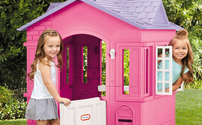 Two Girls Playing in Little Tikes Cape Cottage House Two Girls Playing in Little Tikes Cape Cottage House