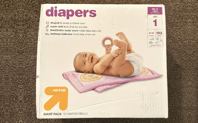 Up Up 192 Count Diapers Box in Size 1 on a Carpet