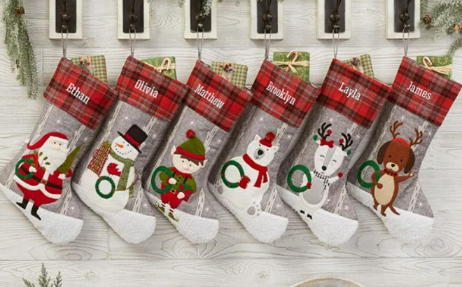 Wintry Cheer Personalized Christmas Stockings above Fireplace