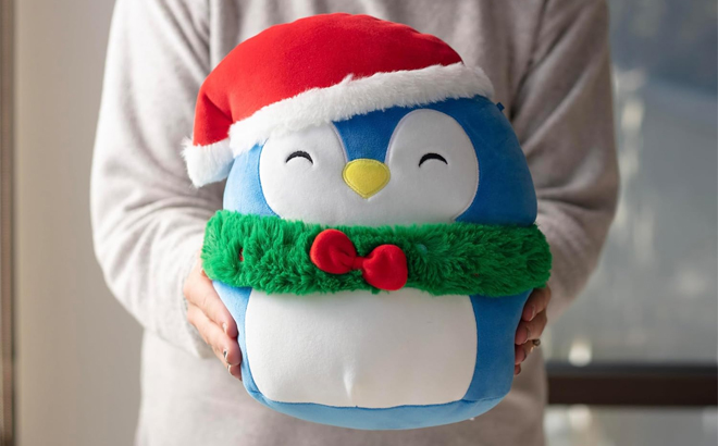 Woman Holding Squishmallows 10 Inch Puff The Penguin Christmas Plush