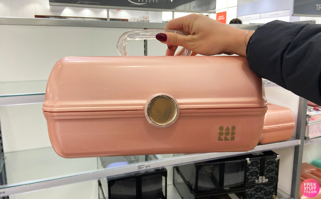 Woman Holding a Caboodles Rose Gold On The Go Girl Makeup Case