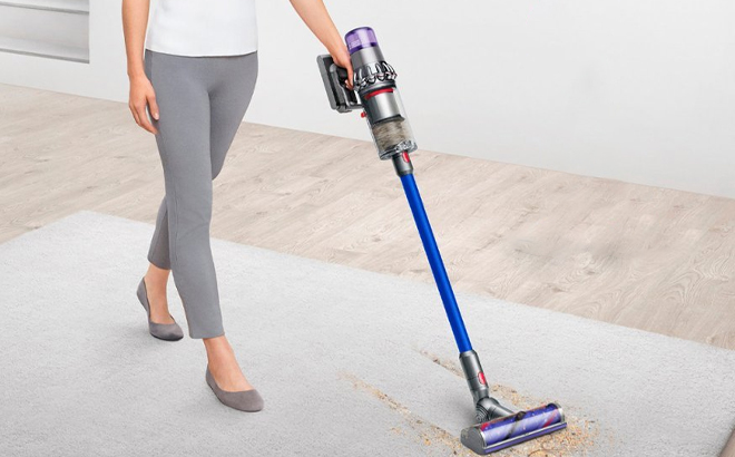 Woman Using a Dyson V11 Cordless Vacuum