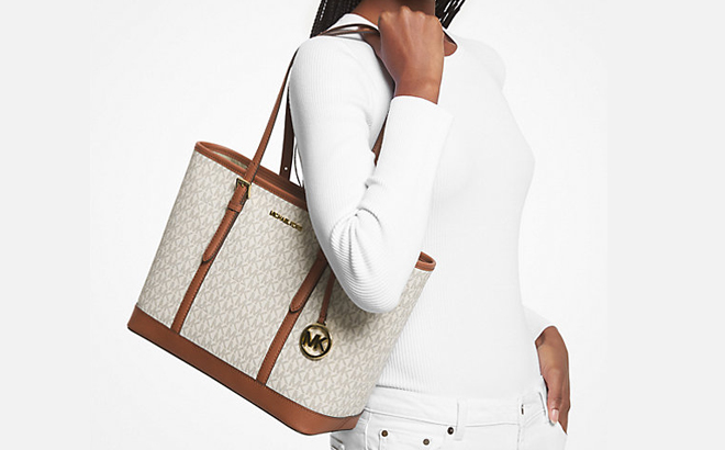 Woman Wearing Michael Kors Jet Set Travel Small Logo Top Zip Tote Bag in Vanilla