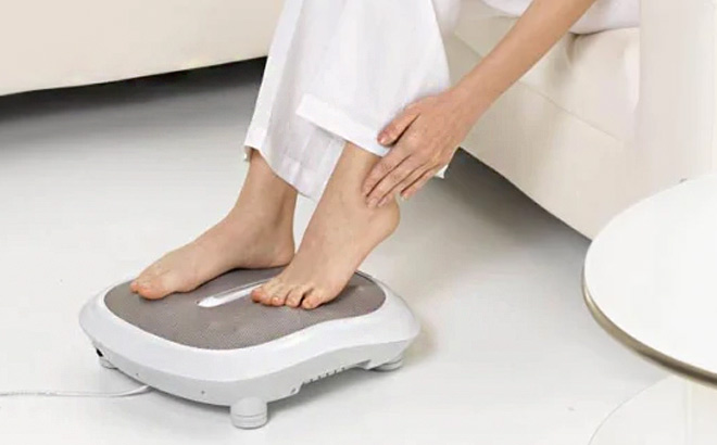 Woman is Using Beurer Foot Massager with Heat