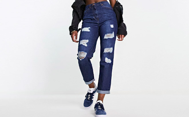 Woman is Wearing Parisian Ripped Boyfriend Jeans in Indigo Color