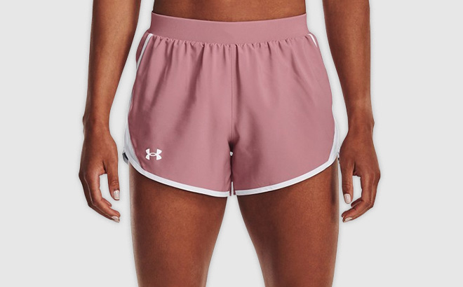 Woman is Wearing Under Armour Womens Under Armour Fly By 2 0 Running Shorts in Pink Elixir Color