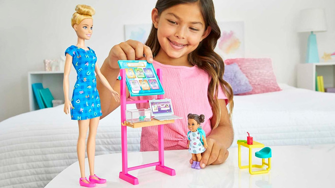 a Girl Playing with Barbie Careers Teacher Playset