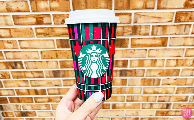 a Hand Holding Starbucks Holiday Cup