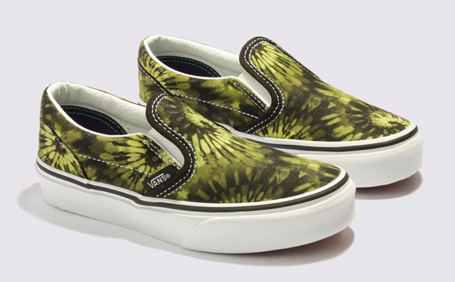 a Pair of VANS Kids Classic Slip On Shoes on a Gray Background