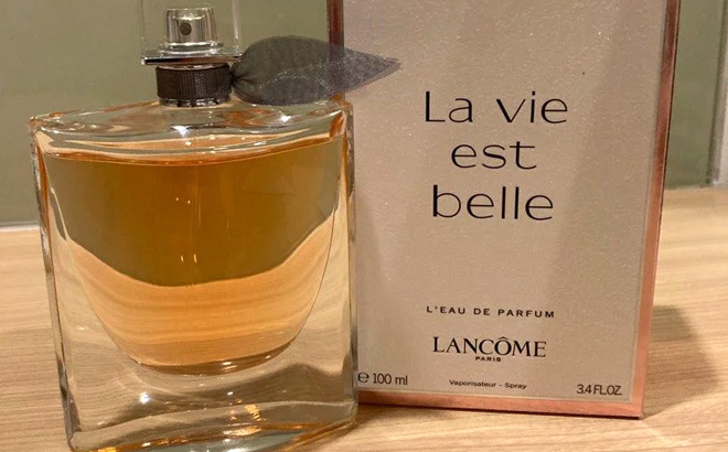 an Image of Lancome La Vie Est Belle LEau de Parfum on a Wooden Table