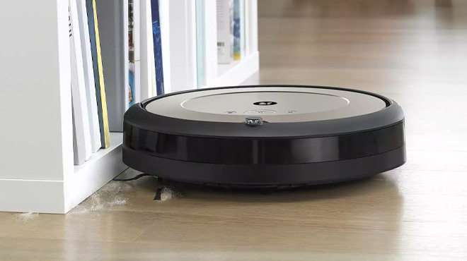 iRobot Roomba i1 Wi-Fi Connected Robot Vacuum Cleaning the Floor at a Home
