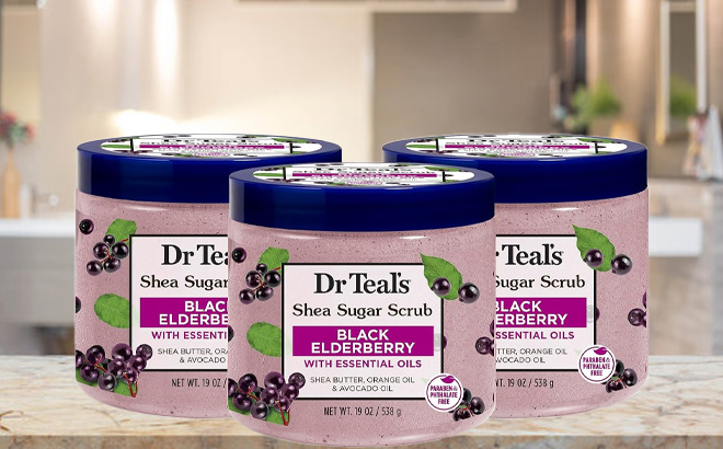 3 Pack of Dr Teals Shea Sugar Body Scrub on Desk