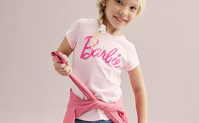 A Girl Wearing a Barbie Girls Distressed Logo Magic Tee