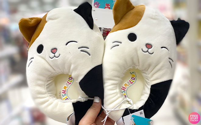 A Hand Hodling Squishmallows Cat Slippers